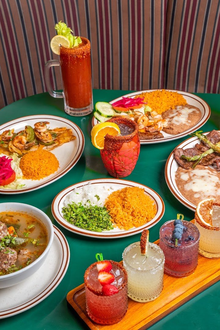 Colorful Mexican plates on a casual restaurant table.