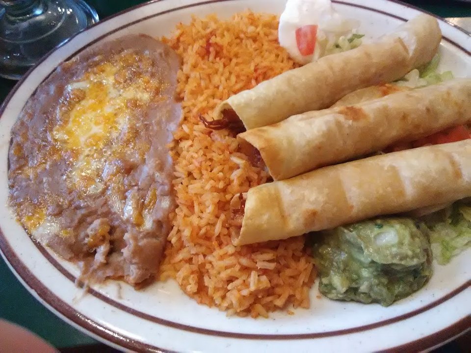 Breakfast menu with omelettes, skillets, and burritos.