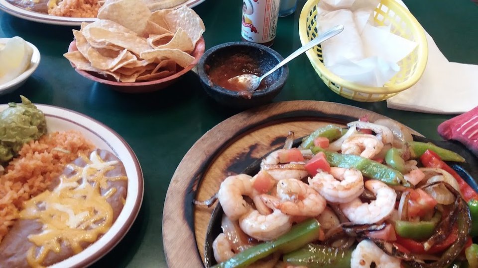 Breakfast menu with omelettes, skillets, and burritos.